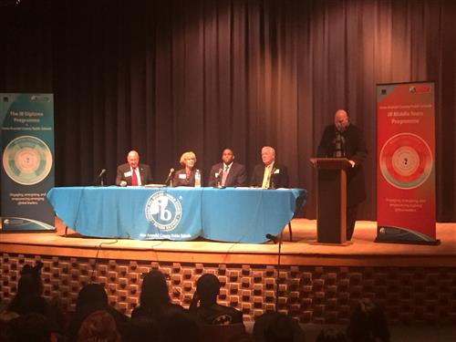 Administrators sitting at a panel table 